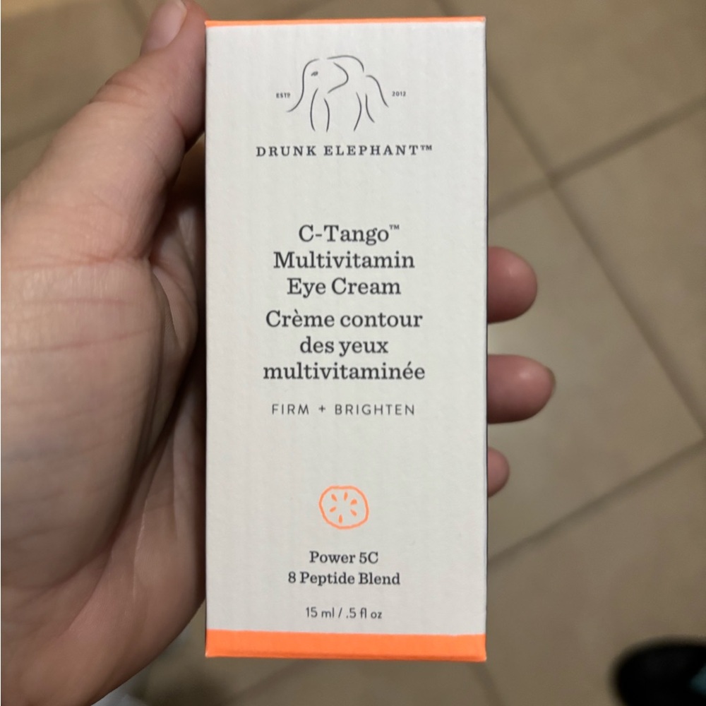 Drunk Elephant Brightening Eye Cream White and Orange